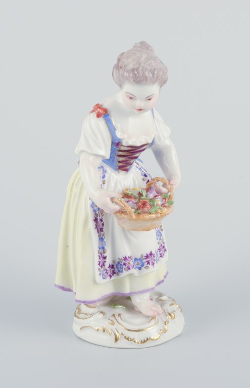 Meissen. Porcelain figurine of girl with basket.