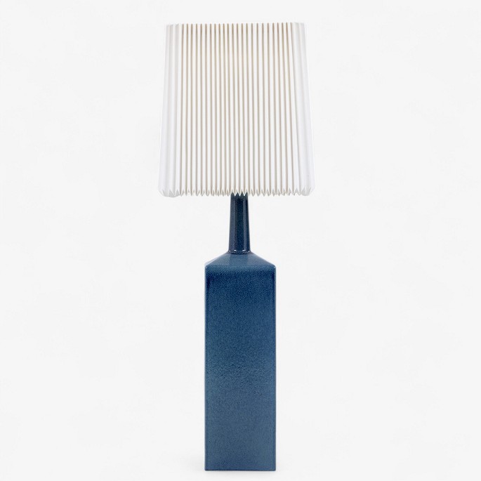 Le Klint
Large table lamp in blue glazed stoneware and pleated paper shade. Signed.
1 pc. in stock
