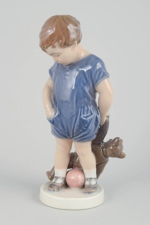 Royal CopenhagenFigurine “Boy with Teddy Bear”, model 3468, 1920s.